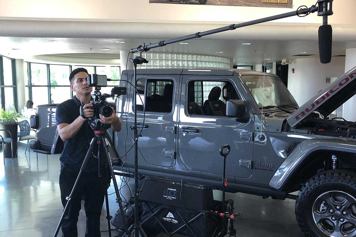 Cameraman shooting promo for Radiant Ride Car Care Program